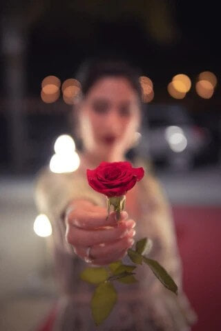 girl holding rose