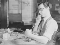 Glassblower Romeo Lefebvre in his workshop in Montreal, 1942. Image From Wikipedia.