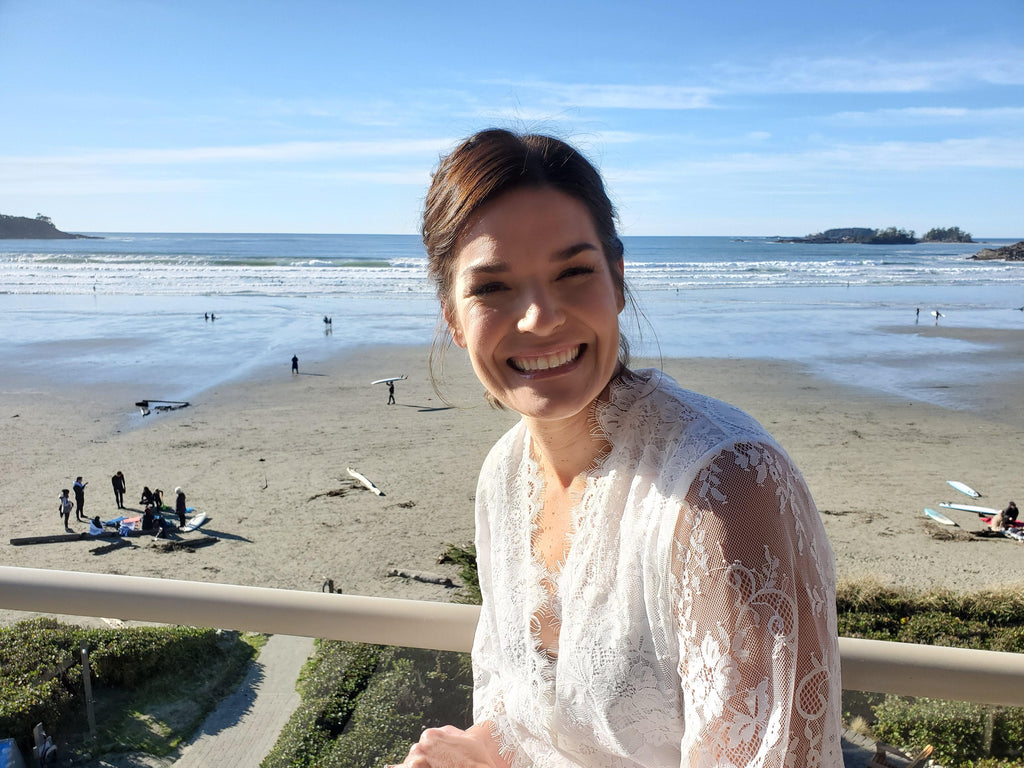 a bride getting-ready in the Lara Lace Robe for a Tofino, British Columbia wedding