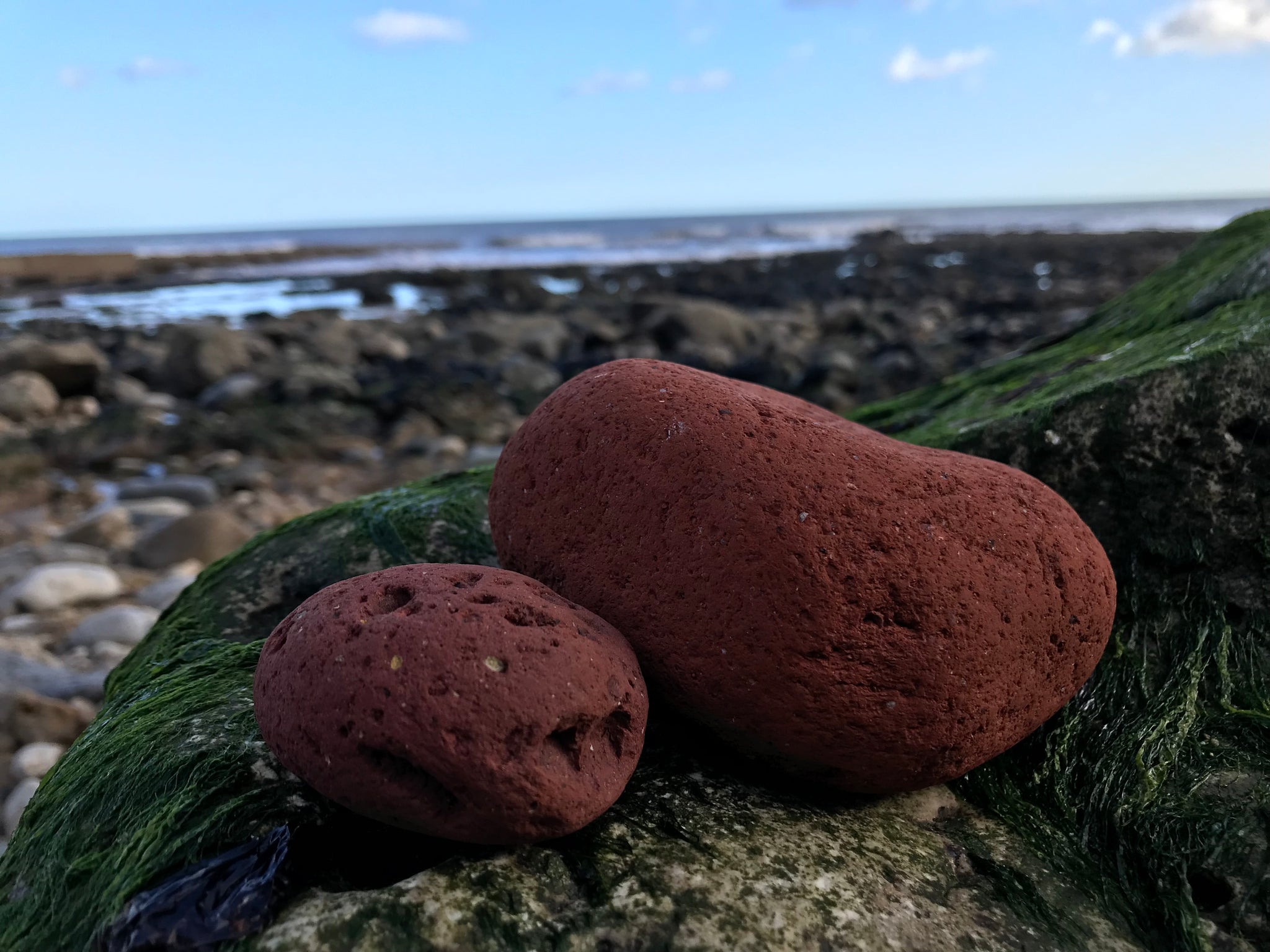 Red house bricks at the beach