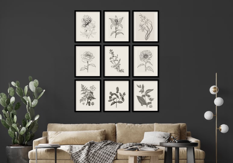 A 9-frame gallery wall hanging above a couch. To create harmony in the gallery, each frame is exactly the same, and the images in each are different, but of a similar style.