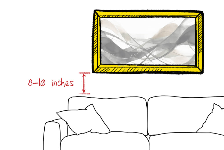 Illustrated image of a picture above a couch and arrows indicating to hang the picture 8 - 10 inches above the top of the couch.