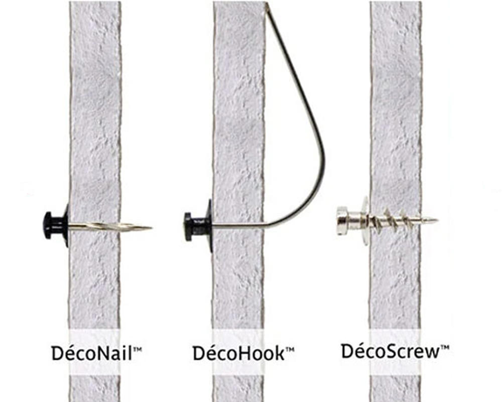 An image showing three different fasteners in drywall that we designed to make picture hanging easy: DecoNails™, DecoScrews™ and DecoHooks™.