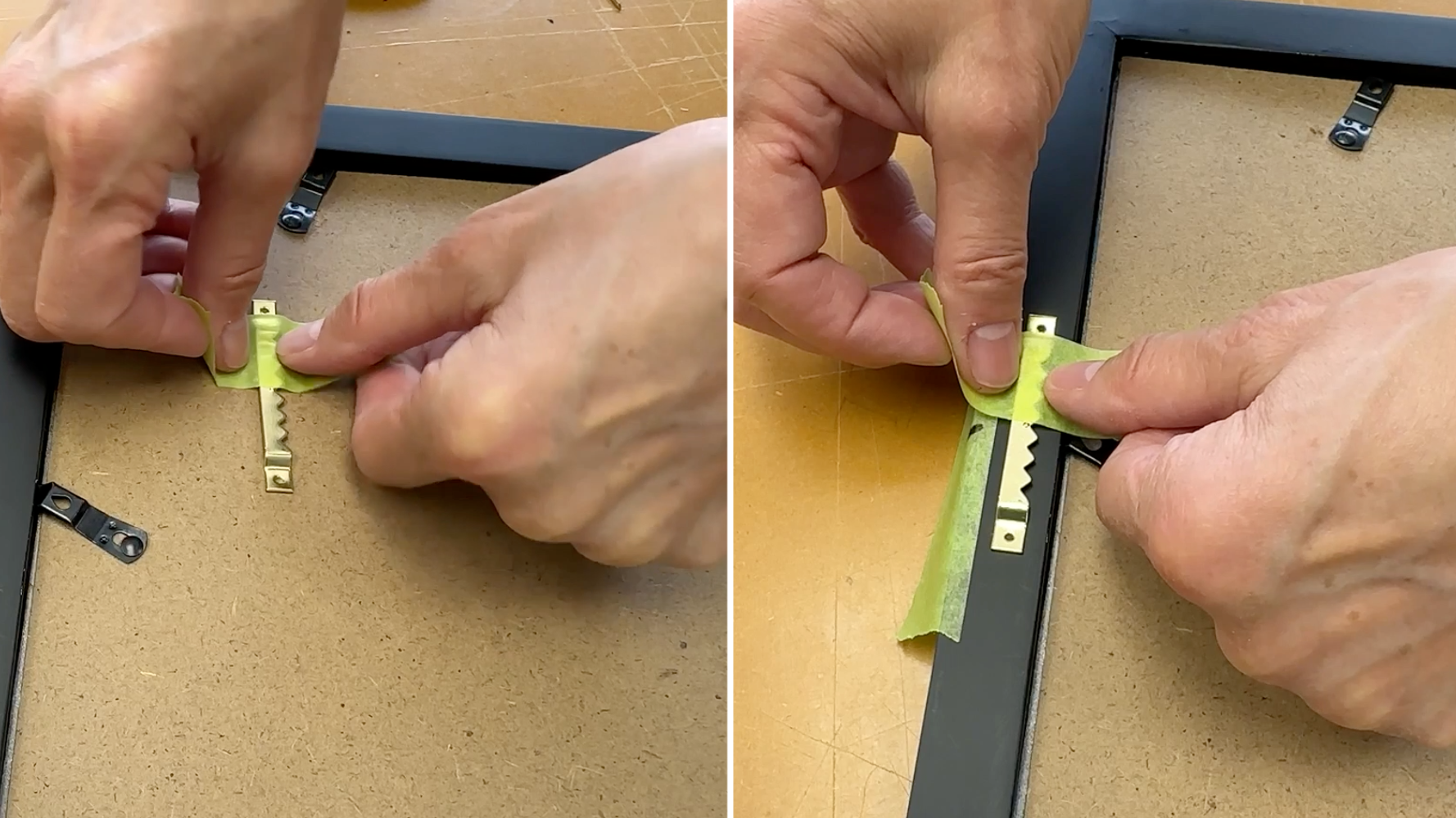Using Painter's tape applied vertically to the sawtooth hanger, a person is aligning the hanger in the right spot on the back of a picture frame.