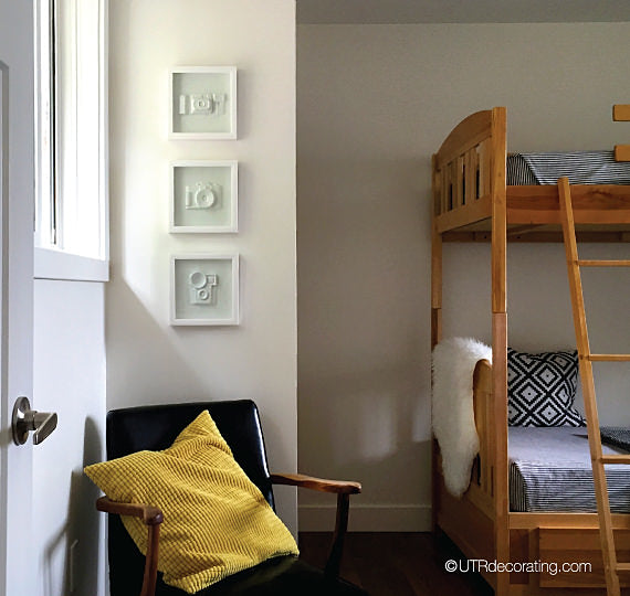 3 shadow box frames on a wall, and example of chic art from big box stores