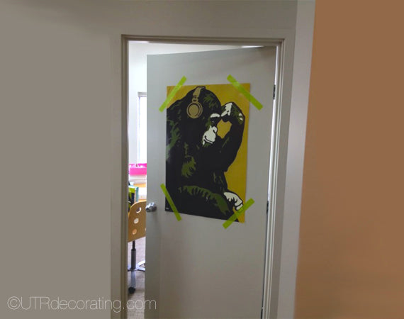 Hang posters in dorm rooms using Painter's tape to avoid damaging your posters and walls