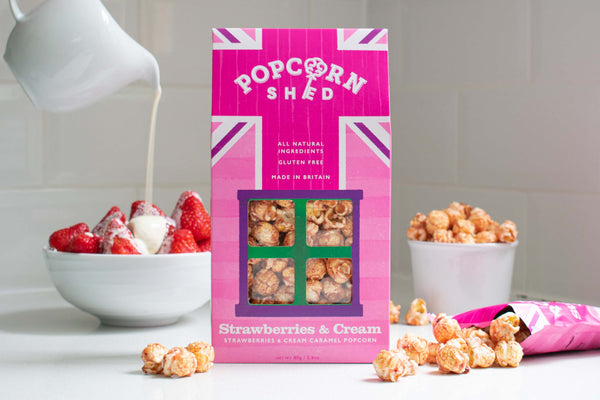 Popcorn Shed's strawberries and cream popcorn in sheds and snack packs