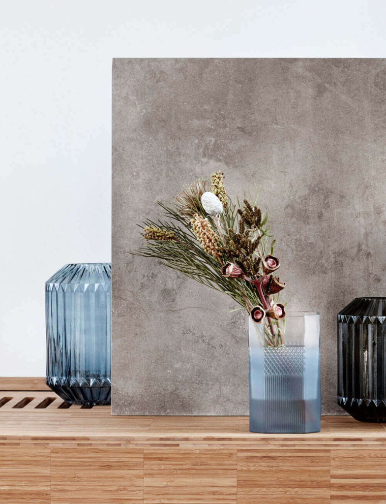 Blue Glass Vases with Flowers on Wood Shelf - escapologyhome.com