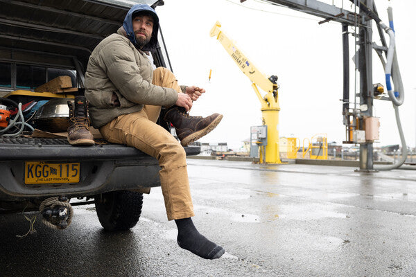 person at work site in cold weather wearing the John Henry work socks