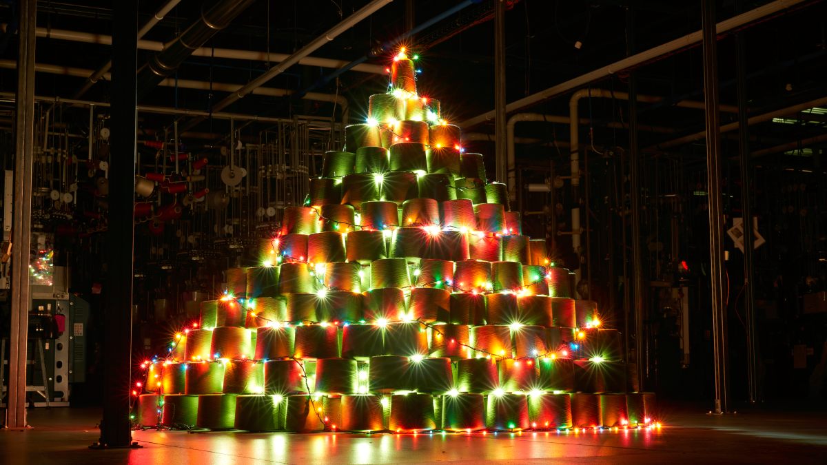 A Christmas tree made of merino wool yarn cones, set up in the Darn Tough mill at Waterbury