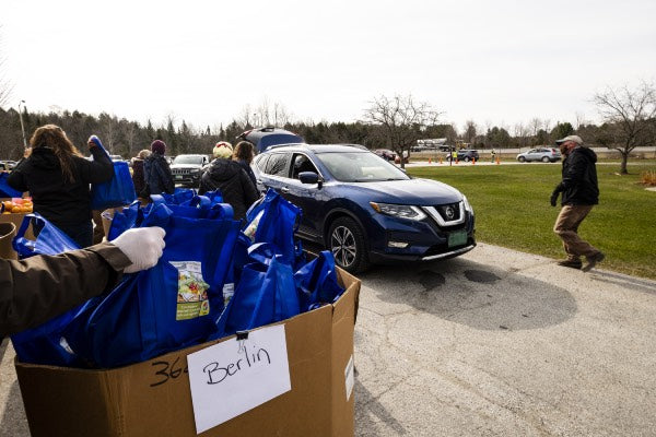 Vermont foodbank volunteers organizing bags of food