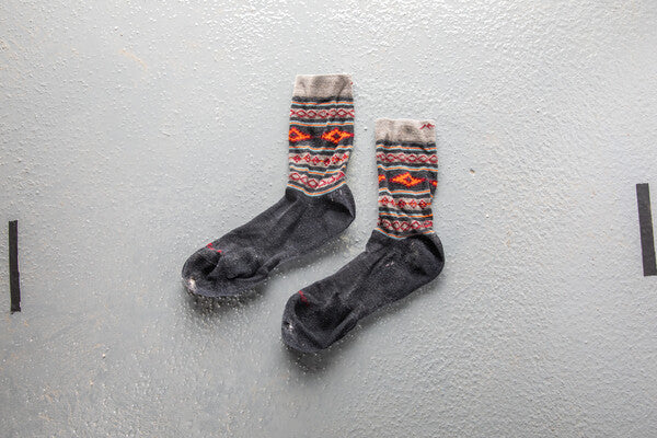 A pair of socks Sara received and replaced under our lifetime guarantee