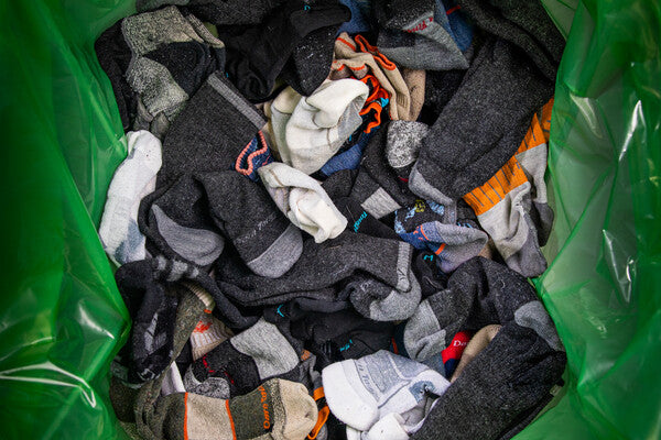 A pile of Darn Tough socks, all jumbled together in a bag