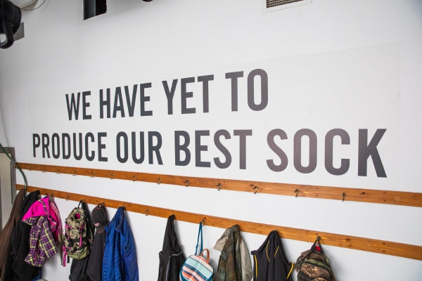"We have yet to produce our best sock" on the wall at the Northfield Mill