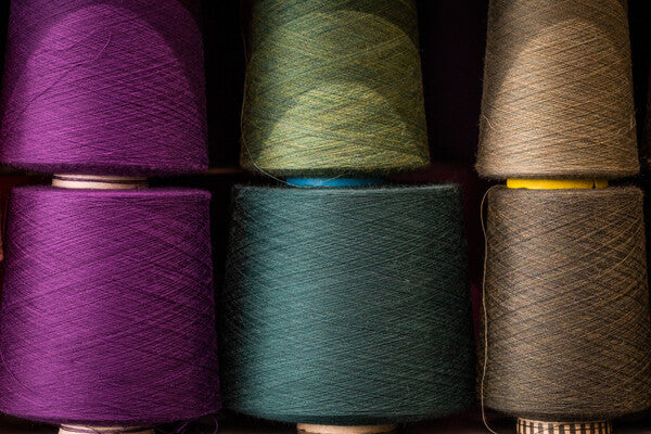 Cones of Merino Wool yarn in multiple colors