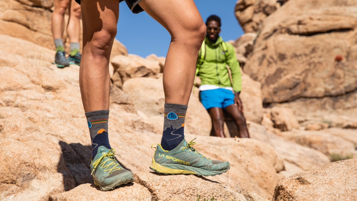 Hiker wearing the CDT socks that support the Continental Divide Trail Coalition