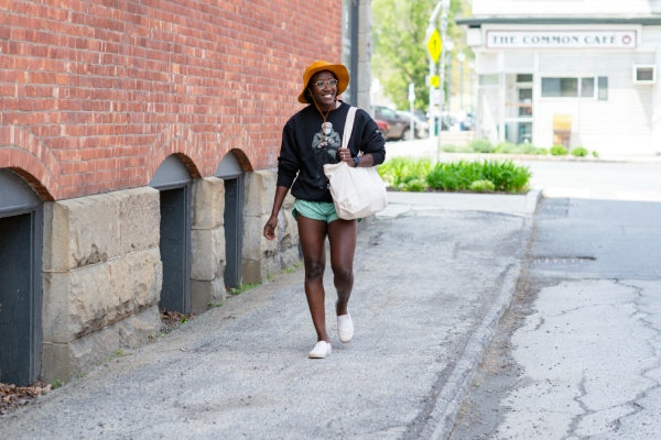 Woman with bag walking around town