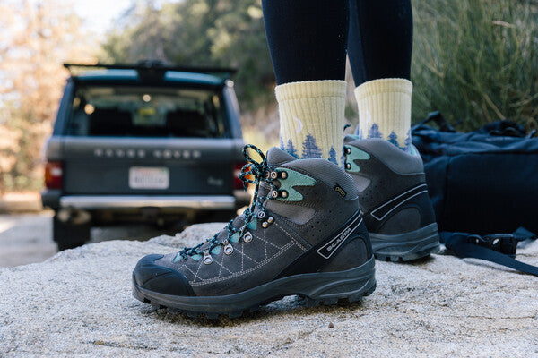 Closeup of hiker wearing the Treeline Micro Crew Socks in yellow