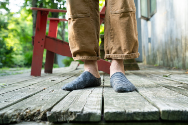 Our tester standing on the deck wearing no show hidden socks that won't slip
