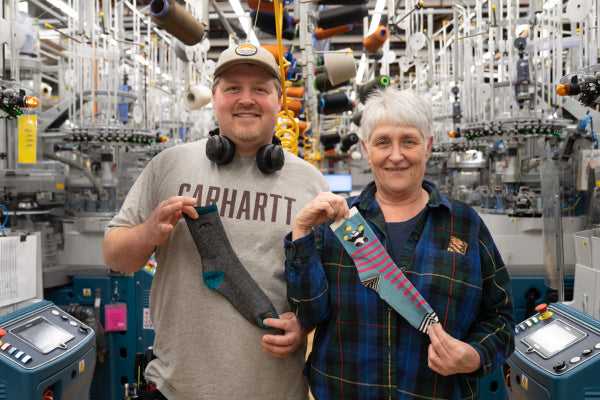 Kevin with his mom Debra showing the sock he'd give her versus the one she'd pick