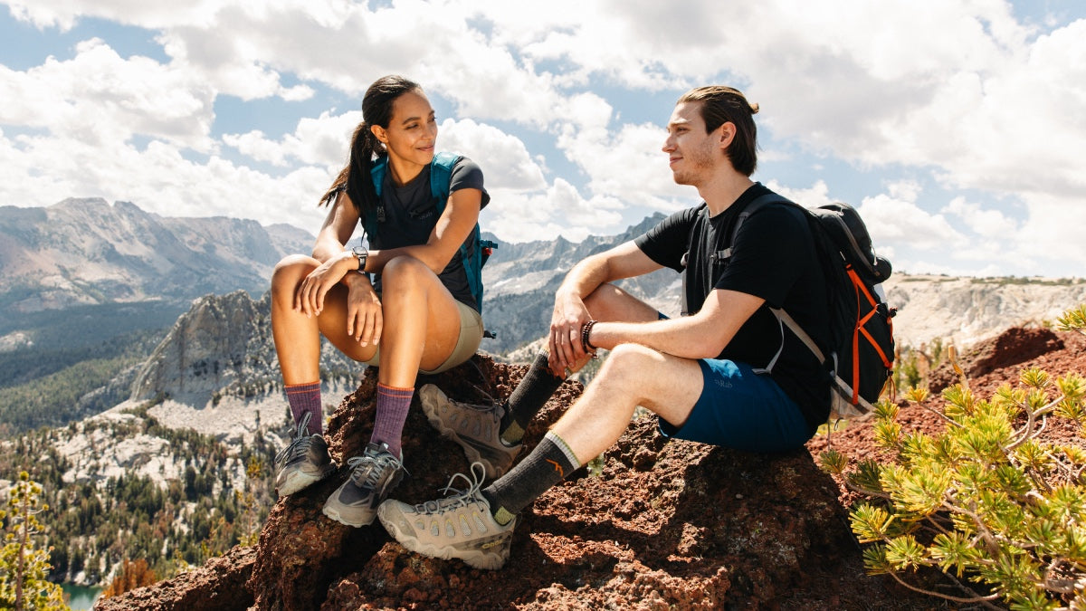 A couple on the summit wearing matching socks they bought each other for Valentine's Day