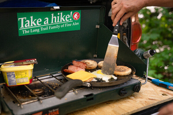 Delicious food being cooked on a portable grill to feed the thru hikers