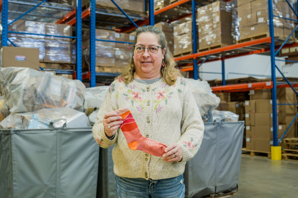 Andrea holding up the Horizon run sock