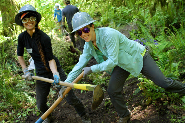 Woman smiling as she does work as part of Trails Skill College