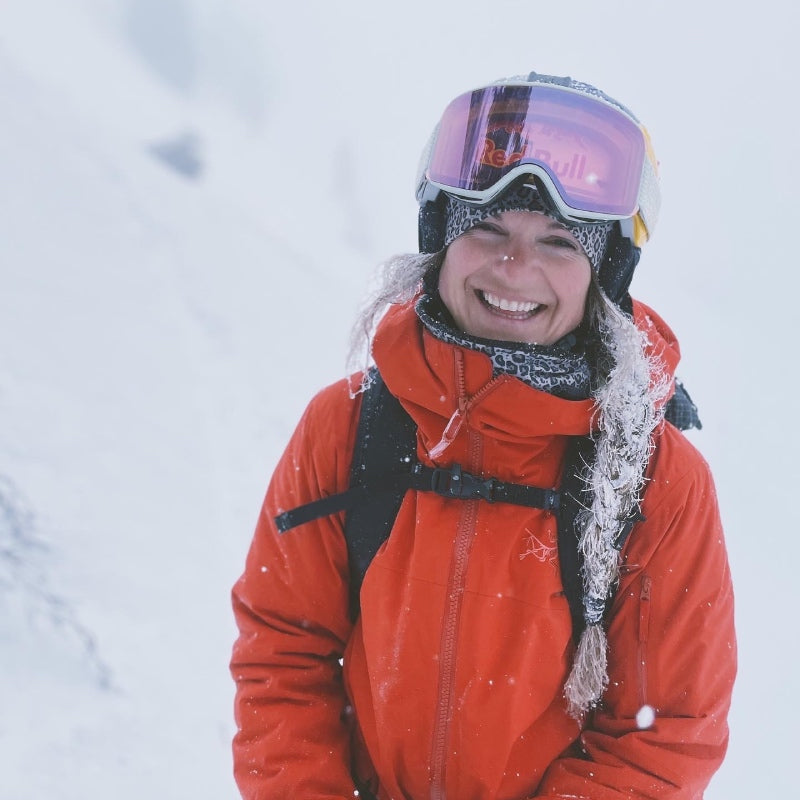 Michelle smiling in her ski gear, with frosty hair