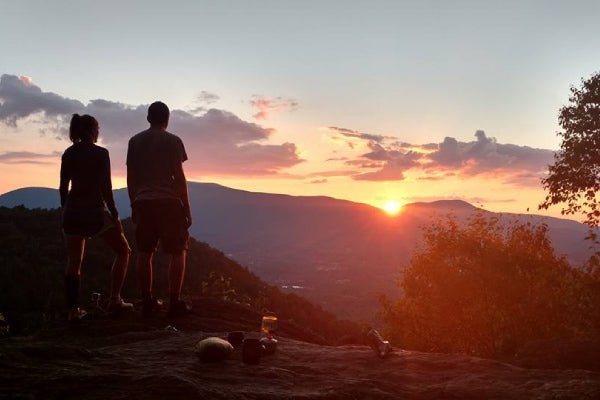 Two hikers admiring a sunset from the AT