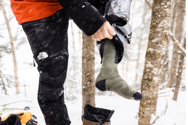 Closeup of snowboarder wearing their darn tough snowboard socks