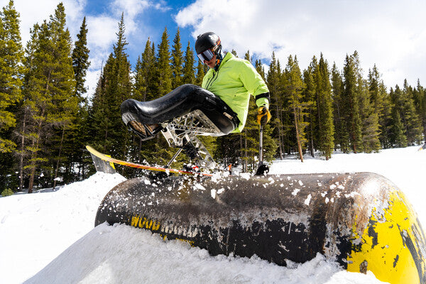 Trevor taking a jump on his sit ski