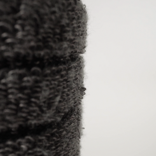 A tiny hook approaching the inside of our socks and gently tugging on a single Terry loop to show cushion