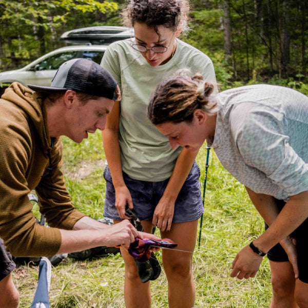 Darn Tough volunteer showing free socks to the thru hikers