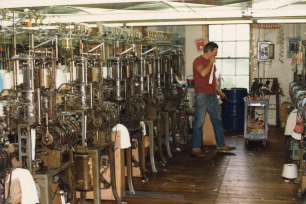 A row of knitting machines at Cabot Hosiery Mills