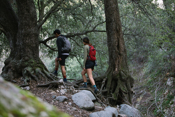 Guy and girl hiking up a trail together