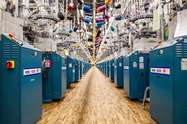 A peak inside the Darn Tough Mill, full of knitting machines with Merino Wool yarns to make socks