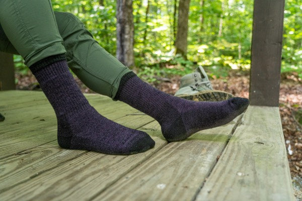 Woman wearing the nomad full cushion socks for hiking