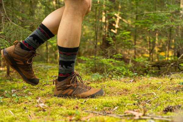 Hiker wearing hiking boots and van grizzle boot socks with bears on them