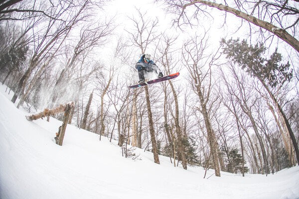 Jake catching some awesome air while snowboarding in Vermont