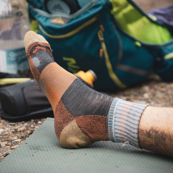 A Darn Tough sock that's starting to wear out after miles on the trail.