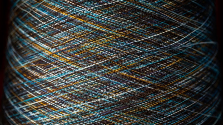 A closeup look at Merino Wool yarns, a cool multi-color yarn with blues and yellows