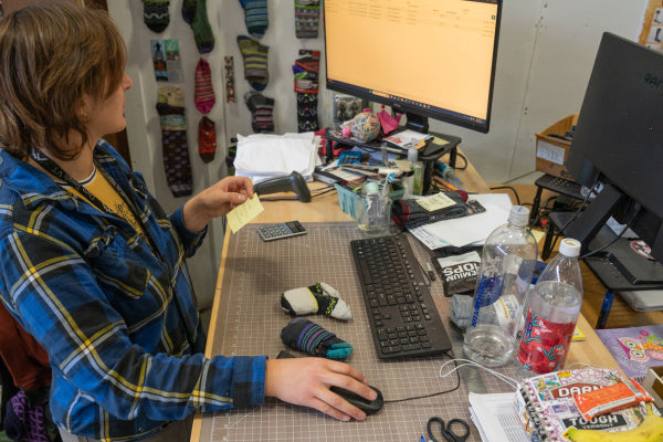 Emily entering warranty information into a computer