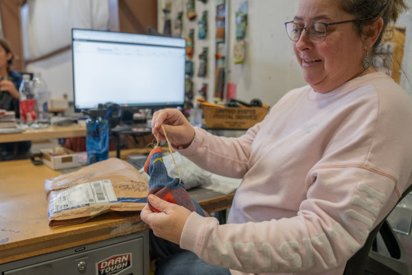 Andrea showing a damaged sock