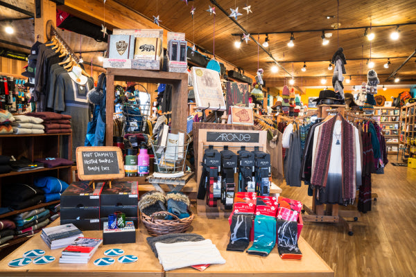A display in Alpenglow Sports showing socks, stickers, and gloves