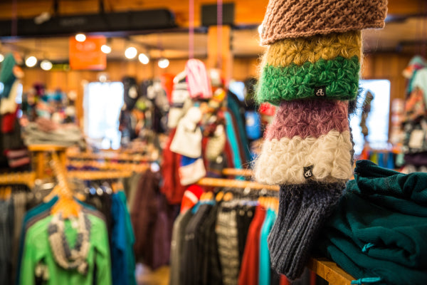 A view of the Alpenglow sales floor, showing fluffy hats and warm clothes