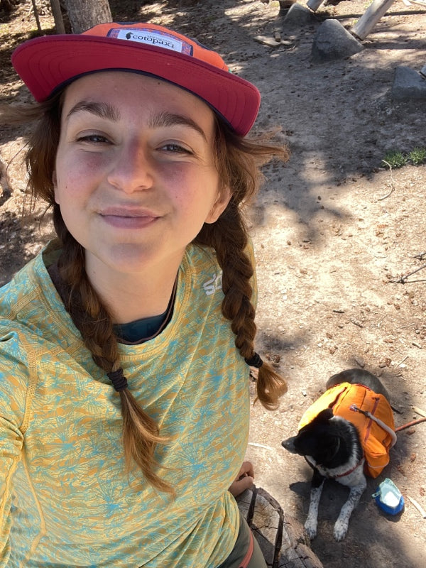 Halle and her dog Lassen taking a selfie on the trail