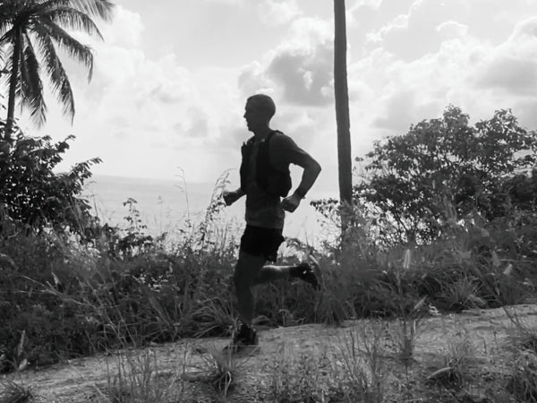 Kris running on a path along the ocean coast