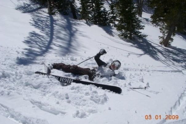 Kevin collapsed in the snow wearing his ski setup