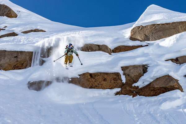 Pro skier Michelle Parker catching some air headed down a slope